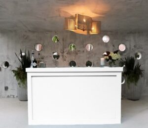 White bar counter setup for event service.