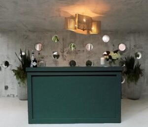 Event bar with jade green exterior paneling.