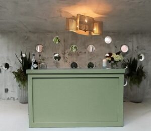 Sage green bar ideal for outdoor weddings.