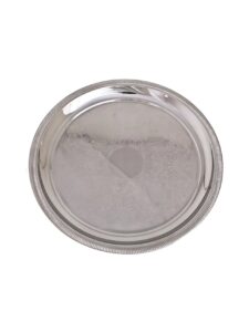 Stainless steel round tray for serving.